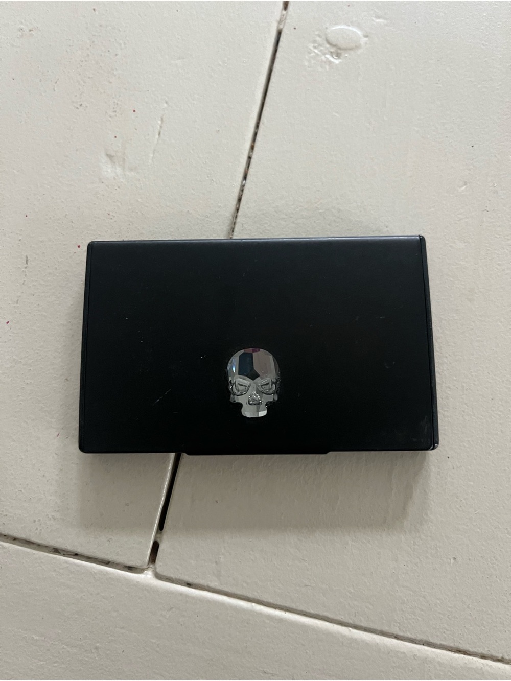 Unisex matte black business card holder with Swarovski skull crystal in center